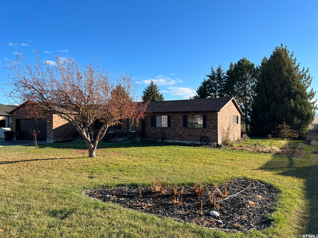 Updated main level home with multiple outbuildings for hay storage, tool storage or other.  The home also features mature landscaping with firepit, fruit trees, garden boxes and a fully functional solar panel system.  Don't miss out on this solid ranch style home.  Call for a private showing.