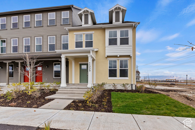 View of front of property with a front yard