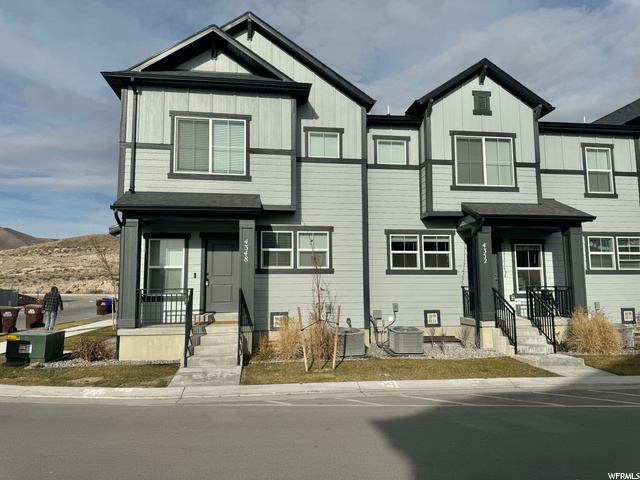 Just like New !  This townhome can have a short term rental , basement completely finished , quartz countertops , laminate , large master with a master bath, each bedroom has a walk in closet  end unit
