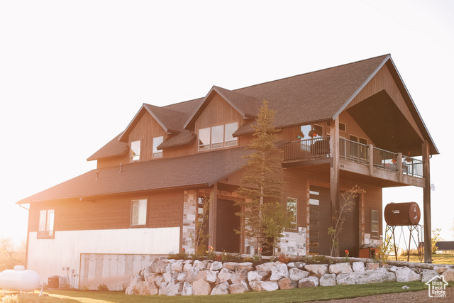 View of front of home with a balcony