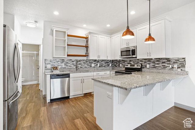 Luxury upgraded townhome for sale! Impeccably maintained by one owner. Features include finished garage, LVT flooring, granite countertops, upgraded lights, and added barn doors. Outside unit on the road. Experience refined living today!