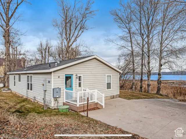 125 feet of beautiful Bear Lake waterfront! 3 bed 2 bath home with an open kitchen and living space. No HOA or CCR's. Can be used as an investment property, vacation home, or full time residence. Mature trees and fully landscaped front yard. Paved parking and boat ramp.