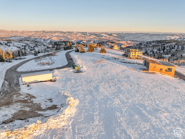 Snowy aerial view with a mountain view