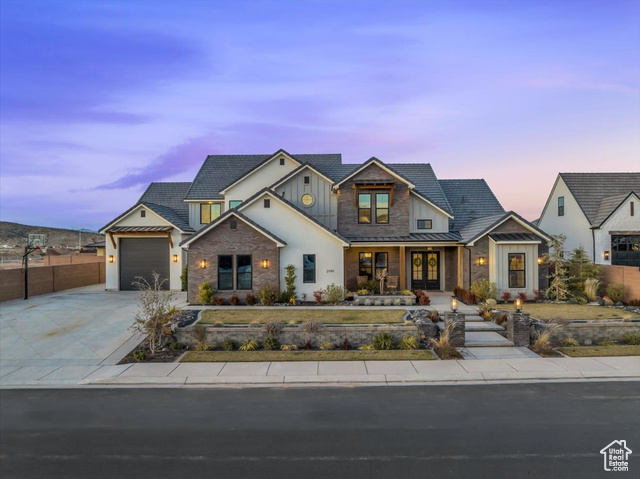 View of front facade featuring a garage