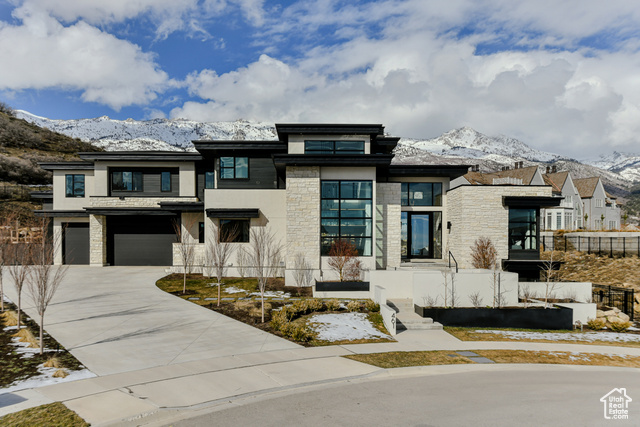Welcome to luxury - Custom-designed, 2-story home, on a cul-de-sac, perched up in the highly-desired Ridge at Alpine subdivision, surrounded by 360-degree mountain, lake, and valley views including Lone Peak, Box Elder, Mt Timpanogos, and Utah Lake. Built by Davies Design and custom architecture by Inouye Design, this home provides an organic modern feel that's timeless. The gourmet kitchen is a chef's dream with side-by-side Miele 36-inch oversized fridge and freezer towers, 4 Miele Auto Dishwashers, a 48-inch Miele 6-burner range, 4 steam assist/full steam ovens, and 2 Miele warming drawers. The adjacent Butler's Pantry, complete with a wet bar and convenient fridge/freezer drawers, allows for additional storage and food prep. The custom European White Oak Hardwood floors, Walnut cabinetry, and Taj Mahal Quartzite countertops add a touch of elegance. Indulge in the opulence of the Primary Suite, featuring an oversized steam shower, heated shower mirror, heated flooring, custom built-in closet organizers, skylight with auto shade, and an LG Studio Styler wardrobe steamer. The adjacent primary laundry room allows for convenience, being plumbed for 2 Washer & Dryer sets.  W/D hookups are located on every level. Expansive windows are highlighted throughout the home and are conveniently maintained through automatic Lutron roller shades. State-of-the-art home theater, equipped with Control4 technology and custom lighting system, offers a seamless and immersive viewing experience. Modern home Gym, accompanied by a private Spa complete with sauna, cold plunge, & meditation room. The cutting-edge HRV System, CWR Custom Total Water Filtration, and Reverse Osmosis System guarantee a healthy and comfortable living environment. Plenty of space for toys and additional storage with an RV Pad and an oversized, heated, 4-car garage which features 3 220v electric car outlets and an indoor Basketball Court. Security is paramount with a hardwired Ring Video Surveillance System and Video Doorbell. Stoney Way Trail runs through the backyard allowing for quick access to biking, hiking, and walking trails to Lambert Park & Three Falls. Don't miss out on the opportunity to make this luxury Alpine oasis your own. Reach out today to schedule a private tour! Buyer/Buyer's agent to verify all info.