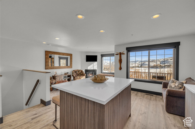 Surrounded by the Wasatch Mountains, overlooking Midway and Heber Valley, this stunning Swiss Oaks townhome offers a perfect mix of contemporary luxury and mountain serenity. From the jaw dropping south-facing views that stretch over open spaces to the impeccable interior finishes, this residence redefines modern mountain living. Enjoy the convenience of an attached oversized one-car garage with direct access to your home. Unload groceries or step into your welcoming abode without braving the elements. The open concept living area is bathed in natural light, creating a warm and inviting atmosphere. Large windows frame the picturesque views, bringing the outdoors inside. The kitchen is a culinary delight with top-of-the-line stainless steel Bosch appliances. Prepare meals with precision and efficiency, surrounded by sleek cabinetry and polished granite countertops. Step outside to one of two private outdoor spaces, enjoy the spectacular views from the upstairs balcony or let the dog out from the lower level walkout patio. Retreat to spacious bedrooms designed for comfort and relaxation where the attention to detail extends to bathrooms with the heated towel racks that add a touch of warmth and sophistication. Enjoy on site amenities through the private clubhouse such as the pool, hot tubs, gym, sauna, dog park as well as tennis, racquetball, pickleball and basketball courts.Whether you're seeking a year-round residence or a weekend retreat, this property combines modern convenience with the tranquility of mountain living. Schedule a showing today and experience the pinnacle of Midway's real estate offerings.