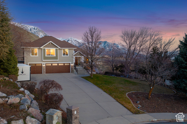 REDUCED PRICE! Nestled on the coveted North Orem/Lindon mountain bench, this stunning home offers unparalleled living with breathtaking views of the valley, mountains, and lake. Immerse yourself in the beauty of nature as you gaze out from the many picture windows, relax on the brand new deck, and enjoy the outdoor living areas. This extremely private home offers more than just stunning views; it grants you direct access to Bonneville shoreline trail leading to Provo Canyon, allowing for outdoor adventures right from your own backyard. Whether it's a leisurely hike or an adrenaline-fueled mountain biking adventure, the possibilities for outdoor exploration are endless. Retreat to the main floor master suite, a luxurious sanctuary where you can unwind and rejuvenate while soaking in the sweeping views from the wraparound deck. With five bedrooms and four living/family rooms, this home is designed to accommodate all your needs, providing ample space for relaxation and entertainment. The home has a lot of upgrades including an induction stove and a new roof installed in 2022. The daylight, walkout basement is an entertainer's delight, boasting a huge family and game room, wet bar/mini fridge, two bedrooms, full bath, and ample storage. You can truly soak in the views from the brand new deck, and with solar panels producing electricity for $9 to $60 a month, sustainable living is made easy. Utopia internet is available, and the recently finished garage includes 220V power. Outside, enjoy the beautiful garden and fruit trees, creating a peaceful oasis.  Check out our video tour https://tours.benaccinelli.com/938ehighcountrydr/?mls Don't miss the opportunity to make this dream home yours - schedule a showing today and experience its idyllic setting and outstanding features firsthand!
