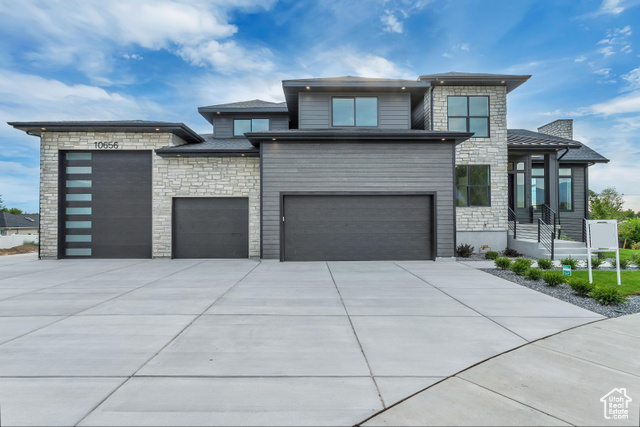 You must see this 6+ car garage attached to this beautiful new construction home! This modern 4 bedroom property has it all plus some extras. Office/flex room on the main floor, mountain views, and a private hot tub deck off the primary bedroom! Hot tub included. The 6+ car garage is impressive! With a 12'x14' door and third bay is 42' deep! Plus RV pad. Basement has access to the backyard. This home is minutes from Interstate 15, 25 minutes to SL International Airport, 25 minutes to world class skiing, and close to many good schools. Information given as a courtesy. Buyer to verify.