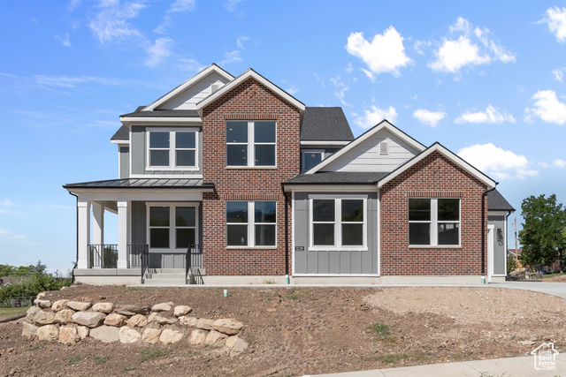 View of front of house featuring covered porch