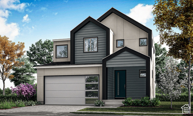 Model Home Photo. Colors will Vary. View of front facade featuring a 2 car garage