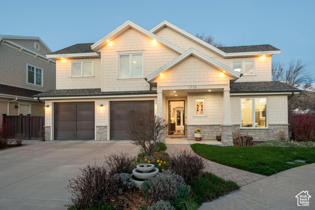 Craftsman inspired home featuring a garage