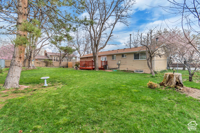 3 Bed 2 Bath brick rambler with room for 4th bedroom or kitchenette downstairs.  Large backyard with mature trees and large wood deck perfect for entertaining, gardening or just relaxing. Two car garage with tons of built in storage. Located close to freeway access and trax.