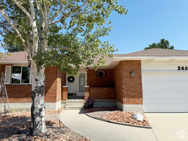 Single story home with a garage