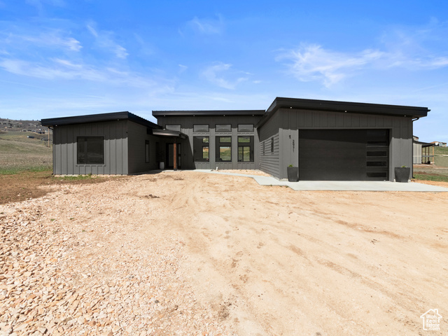 View of front facade featuring a garage