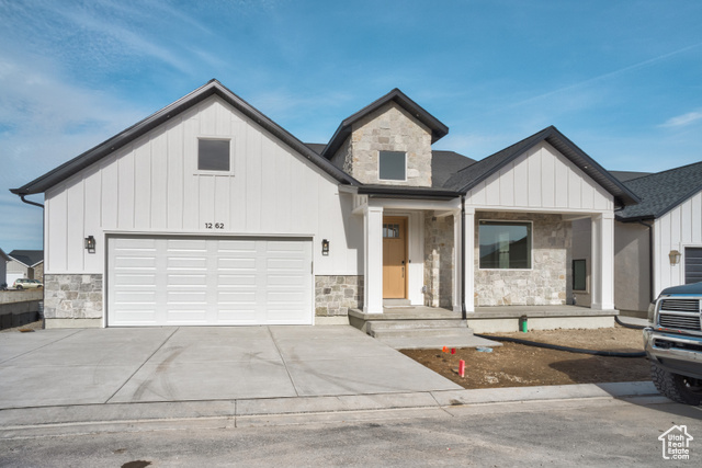 View of front of property featuring a garage