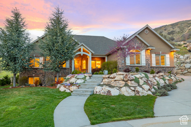 Rare opportunity to own one of Utah County's most desirable mountainside cul-de-sac luxury homes! Enjoy panoramic views of Utah Valley from your mile-high patio and take in epic sunsets from your private backyard. The Bonneville Shoreline trail is just steps from your front door with access to Mt. Timpanogos hiking and mountain bike trails. Relax peacefully on your patio as the quail babies run through your yard in spring and wild turkeys and elk pass through in winter. This open floor plan has lots of natural light and has been well cared for. Ample storage including a walk-in pantry, large laundry room, extra basement storage, and oversized third garage space with room for bikes, boats, campers, and other adventure equipment. The fully finished basement includes an enormous family room with a big-screen projection movie theater with surround sound. All upstairs bedrooms have new custom closets, including a spacious walk-in closet in the master. All appliances stay including kitchen stainless steel, washer/dryer, and extra stainless refrigerator in the garage. Other amenities include a home-wide water softening system, central vacuum, dual-zone climate control, gas fireplaces on both floors, new shutter and/or honeycomb blinds, natural hardwood floors upstairs, custom kitchen cabinets, and an en suite bathroom in the master with whirlpool tub and walk-in shower. The home is also pre-wired for 10gig fiber internet from Utopia and has an electric vehicle outlet installed in the second garage. Low-maintenance landscaping with complete sprinkler coverage and mowing strips along all the freshly mulched beds. Walking distance to the Murdock Canal Bike Trail and new Lindon Temple, and a short drive to Sundance Mountain Resort. Move-in ready, don't let this one get away!  Square footage figures are provided as a courtesy estimate only and were obtained from County Records.  Buyer is advised to obtain an independent measurement.