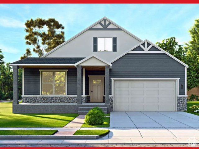 View of front of house with a front yard and a garage