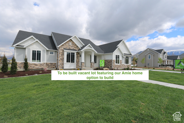 Craftsman-style house with a front lawn