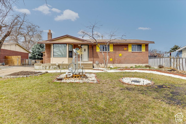 View of front of house with a front lawn