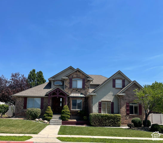 View of front of property with a front lawn