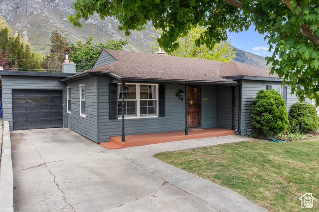 This sweet home is very close to BYU in a quiet neighborhood. The 1283 Sq Feet does not include the large sun porch that is inclosed with newer windows and heater. There is new paint inside and out and the original hard wood flooring is freshly refinished. This home has been well taken care of and is move in ready. There is a large living room and the addition provides another family room with a wood burning stove.  There are two additional work shops as well. Enjoy the lush backyard on the East of the house. This home is a gem!