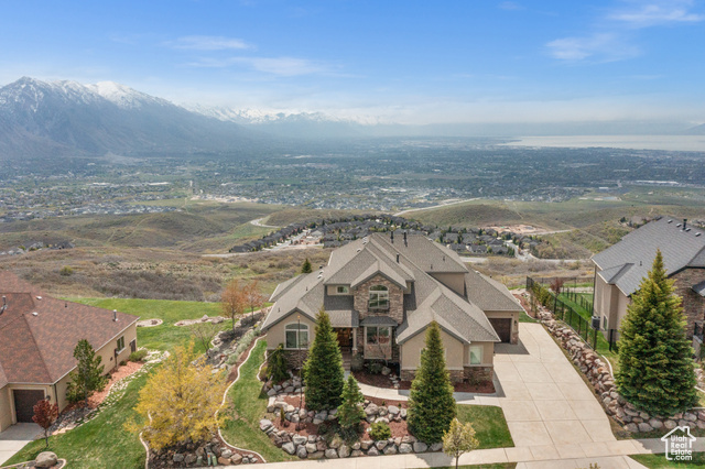OPEN HOUSE Saturday, May 11th from 12:00-2:00. Take a deep breath--of fresh, clean mountain air! You will love where you live as this home boasts some of the most spectacular VIEWS in the community! The expansive deck is perfect for entertaining or just relax and take in the endless sights of the valley, lake and mountains. You will not want to leave-and you won't need to with the main floor (new flooring) having massive windows (of course!), a beautiful open kitchen and dining area, vaulted ceilings, rock fireplace, an impressive executive office, large laundry room,  and huge master suite all on the main floor. The loft upstairs offers an extra peaceful space for family and everyone can unwind downstairs in the 2nd family/game room then step into your personal, custom sauna after a fun day of outdoor activities! The third car garage is a must see w/workbench and heated for those winter projects. World class hiking/biking trails are literally outside your back door. This location offers a rare opportunity of seclusion with captivating scenery and privacy or if you choose, take full  advantage of the top notch amenities that include a clubhouse, pool, hot tubs, tennis courts, fire pit, park and lots of extra activities throughout the year. This home will not disappoint.   Love where you live!
