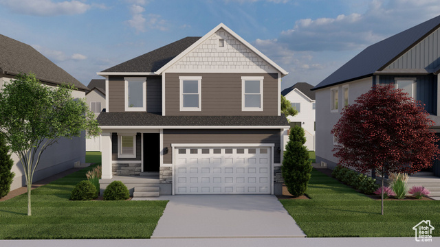 View of front facade with a garage and a front yard