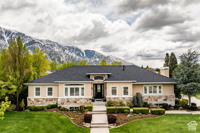 This delightful transitional modern home with STUNNING VIEWS near the mouth of Little Cottonwood Canyon is sure to captivate your amazement. The morning sunrise floods the kitchen with warmth and radiates off the marble countertops through the main level with all of the vaulted ceilings and connected spaces. In-kitchen dining and breakfast bar allow for guests or friends to be "in" the kitchen without being intrusive. The dining room flows naturally onto the deck with seating space next to the grill, and that cascades down to an immaculate backyard where you feel like you're in the mountains. PRIMARY SUITE is on the MAIN LEVEL, with a seating area and a fireplace, it's a true retreat. Home office and formal living complete the main floor. Basement has abundant natural light as well, with a FULL KITCHEN and exterior entrance, it's a perfect option for a mother-in-law apartment, ADU, or an entertainer's basement. FIVE-CAR GARAGE with ample driveway parking and RV parking on the side of garage. BRAND NEW ROOF presidential tile asphalt shingles. NEW FEATURES include new paint, new carpet, new countertops, two new water heaters, new radon mitigation system, new water softener, storage rooms, craft room, trex deck, double ovens, vaulted ceilings, private street, culdesac, views galore. Two IRRIGATION WATER shares from South Despain Ditch company are available.