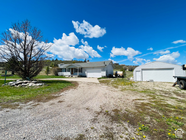 Price Drop! Great home in Bailey Creek subdivision on .96 of an acre. 4 bed 3 bath with a large detached insulated shop. Brand new no maintenance back deck, full sprinkler system, lots of parking, 2 family rooms, and a walk-out basement.