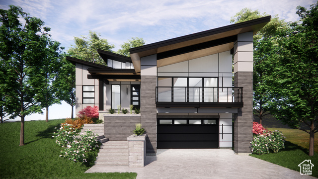 Contemporary home featuring a garage and a front lawn