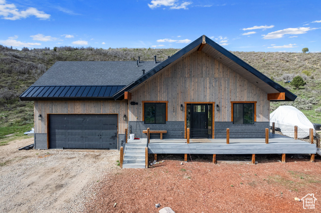 View of front of home featuring a garage