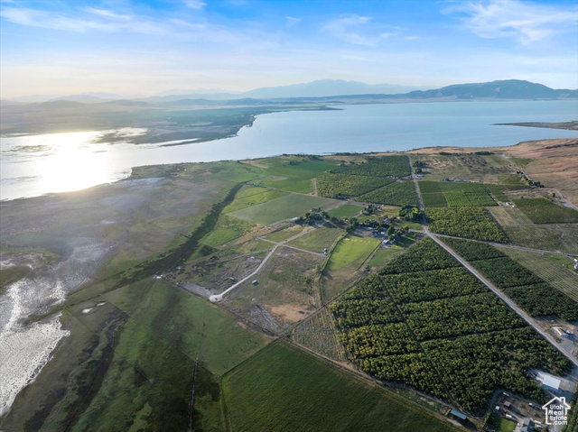 Drone / aerial view featuring a rural view and a water and mountain view