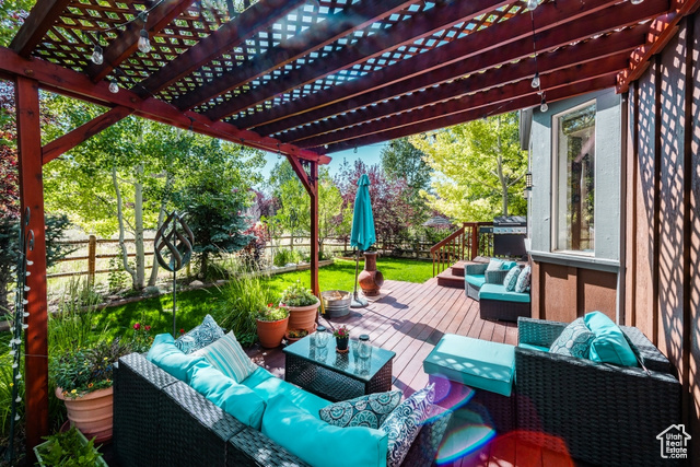 View of patio / terrace with a pergola, an outdoor living space, and a wooden deck