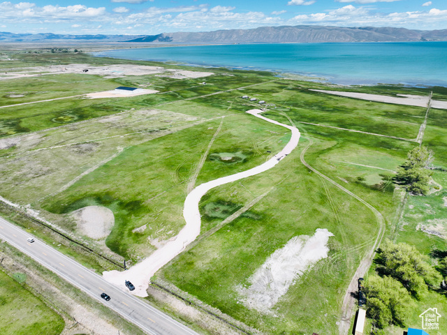 Prime Waterfront development land on the West shores of Bear Lake Idaho/Utah. 1,313 feet of waterfront access. Power has been ran to the middle of the property, a commercial well has been drilled, and a new access and 2,000 feet of road has been installed. Property consists of 2 different parcels being sold together. Access is off Highway 89 with prime exposure and development possibilities.
