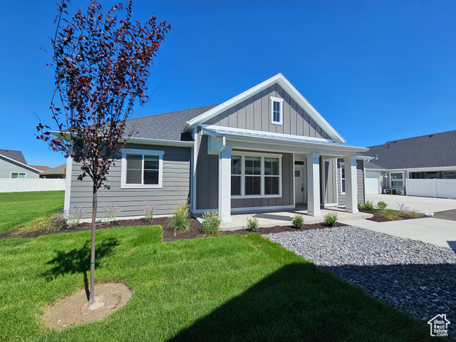 View of front of property with a front lawn