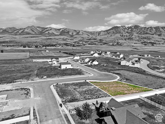 Birds eye view of property with a mountain view