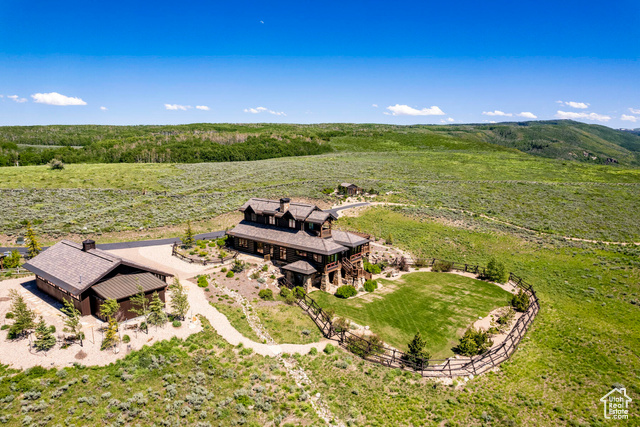 Birds eye view of property with a rural view