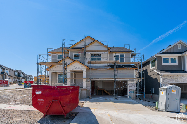 View of front of home featuring a balcony