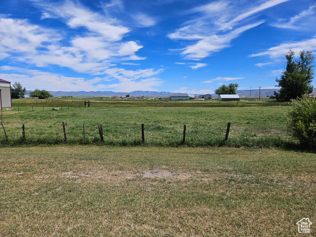 View of yard featuring a mountain view and a rural view