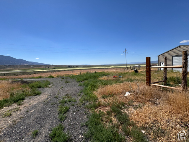 View of yard featuring a mountain view and a rural view