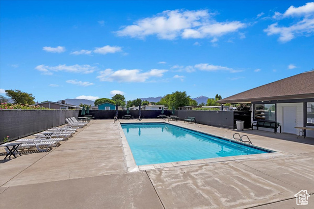 View of swimming pool with a patio