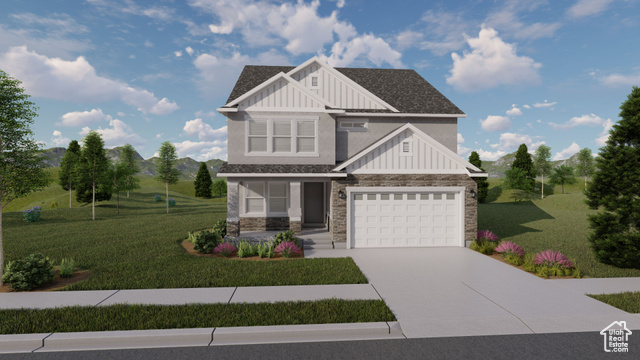 Craftsman-style house featuring a garage and a front lawn