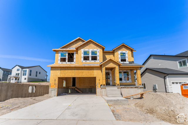 View of front of property featuring a garage