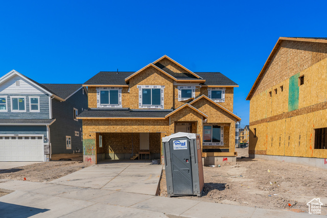 View of front of property featuring a garage