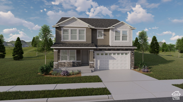 View of front of home featuring a garage and a front yard