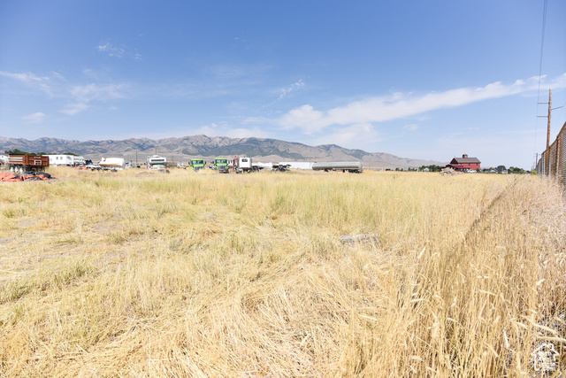 Property view of mountains with a rural view