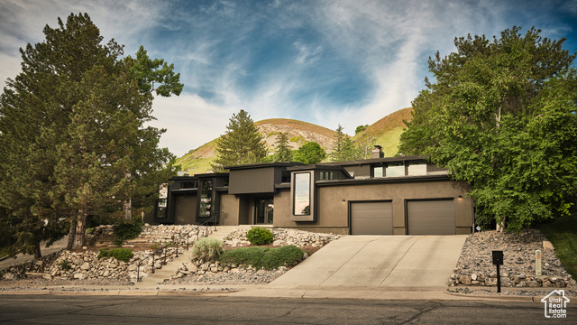 View of front facade featuring a mountain view and a garage