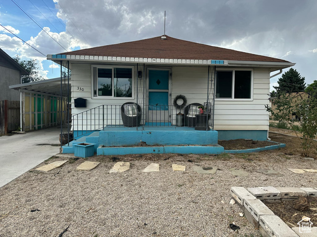 Bungalow featuring central AC unit