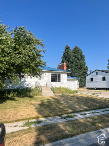 View of front of property with a front yard