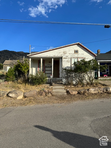 View of front of house with a mountain view